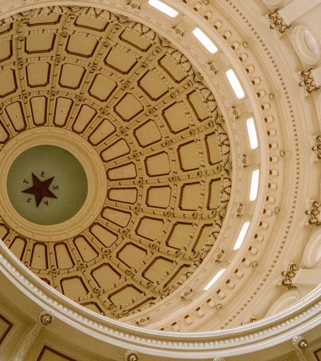 A low angle shot of the Texas State Capitol dome interior design in Austin, Texas